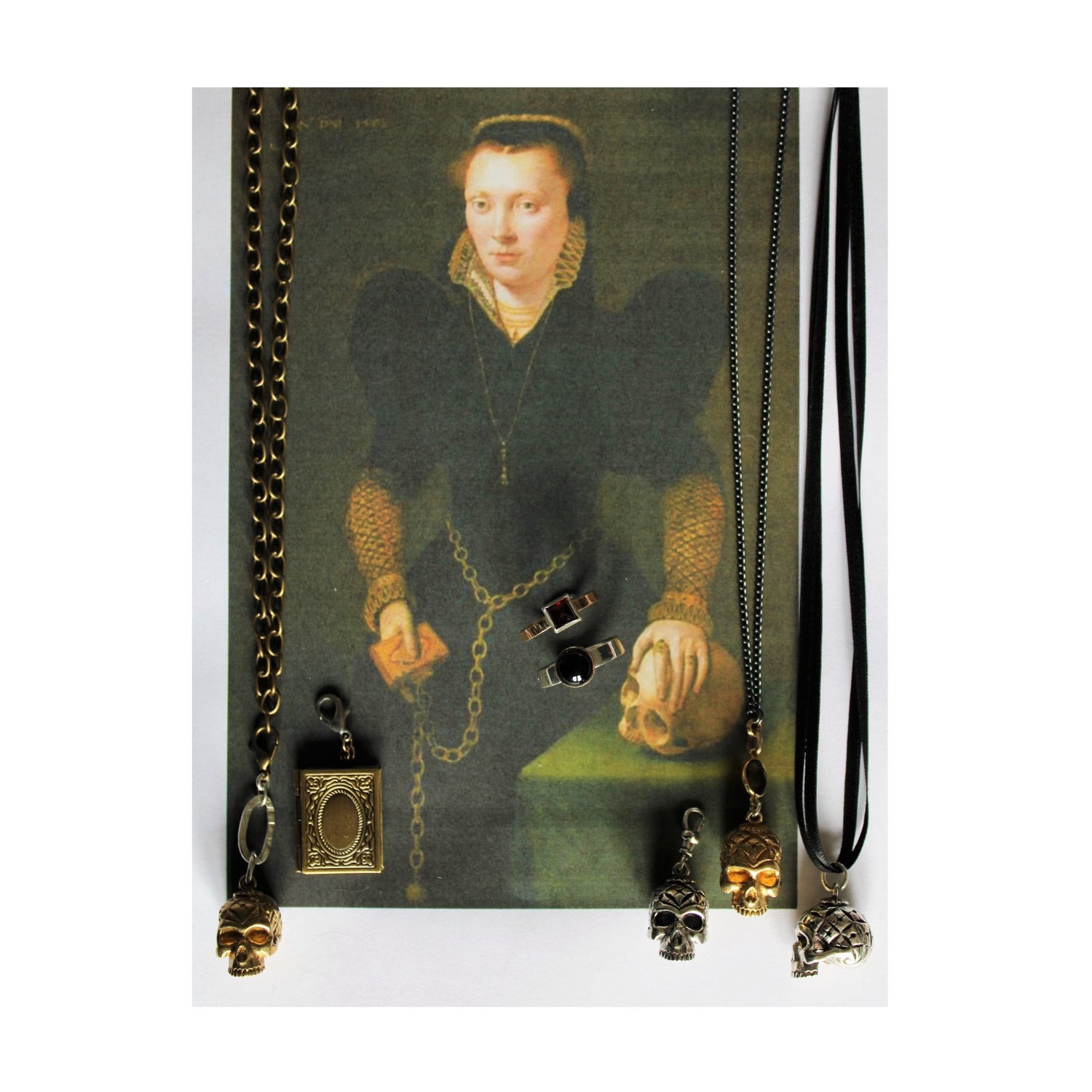portrait of a lady, holding a skull and a book. Jewellery overlaid on top to match the pieces in the portrait